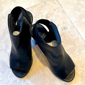 Stuart Weitzman black leather open toe bootie.